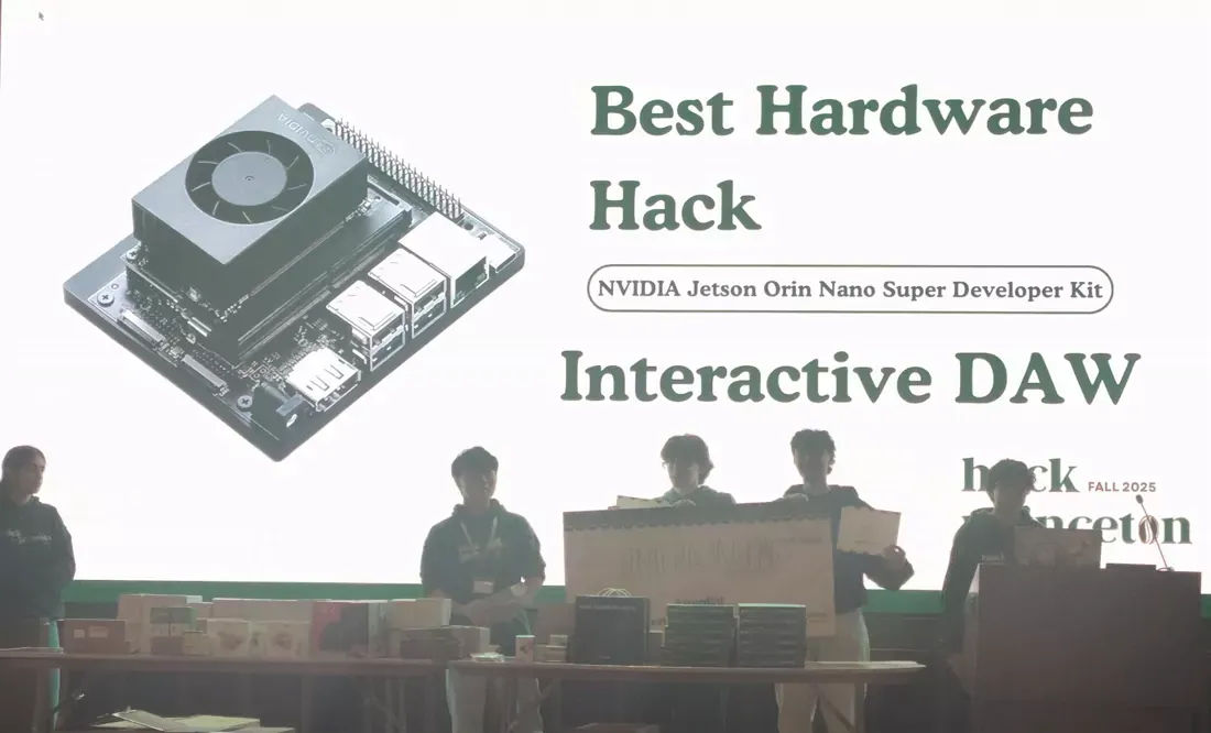 The Best Hardware Hack award slide projected at HackPrinceton Fall 2025, naming Interactive DAW, with the team on stage below it